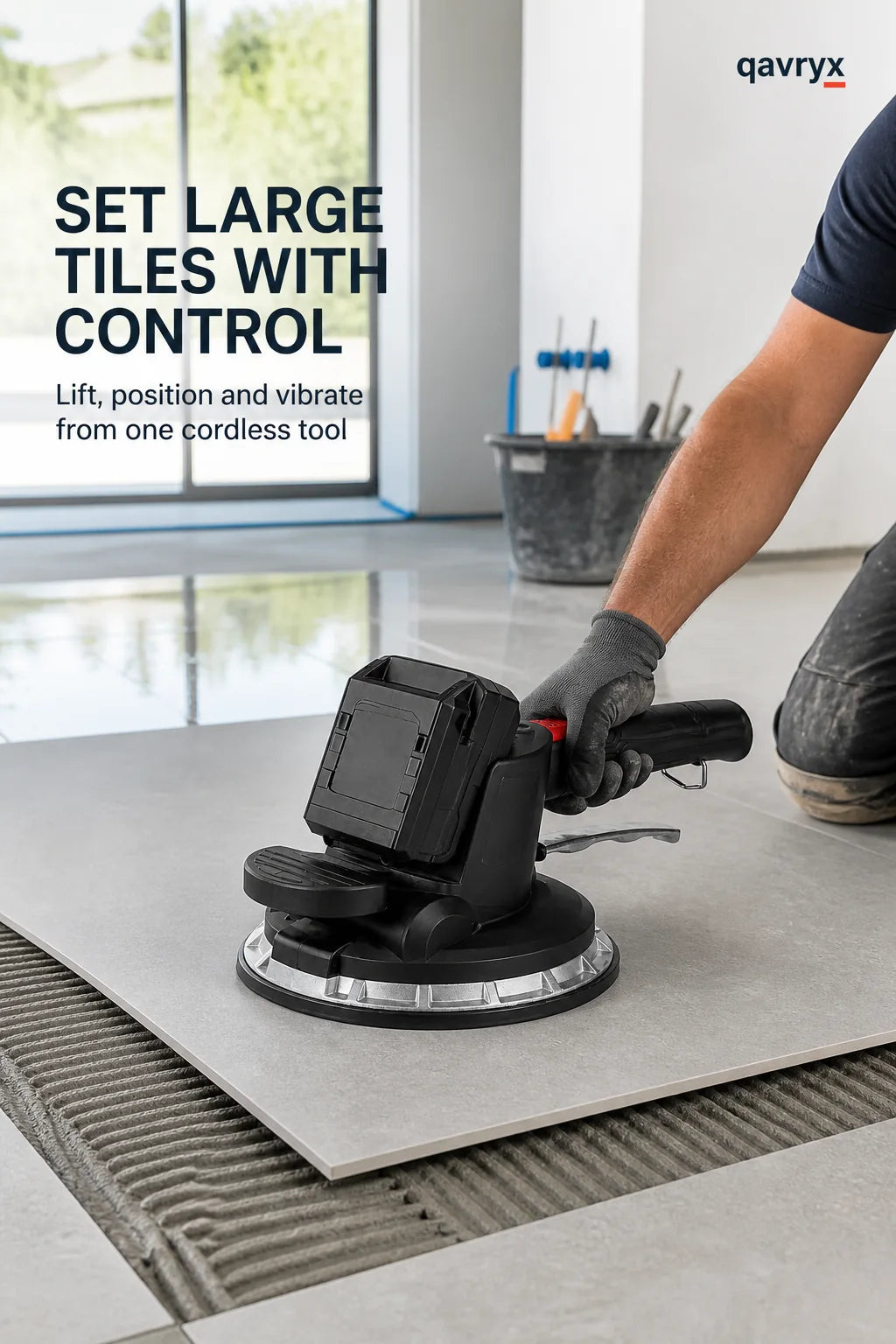 Tile vibrator settling a large tile during installation